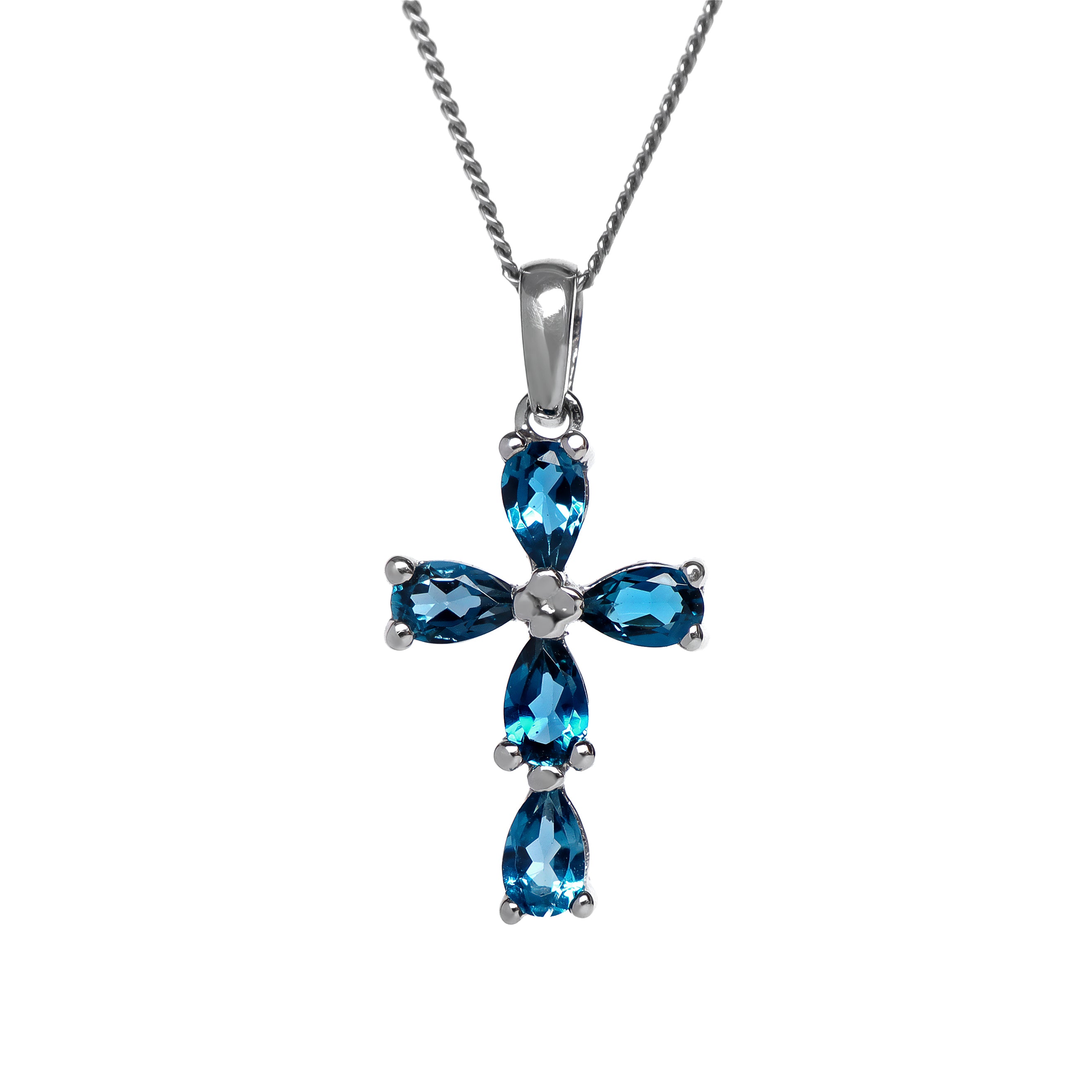 A product photo of a white gold london blue topaz pendant sitting against a white background. The ornate pendant is cross-shaped, made up of 5 pear-cut topaz stones and simplistic white gold detailing. It is suspended by a simple white gold chain.