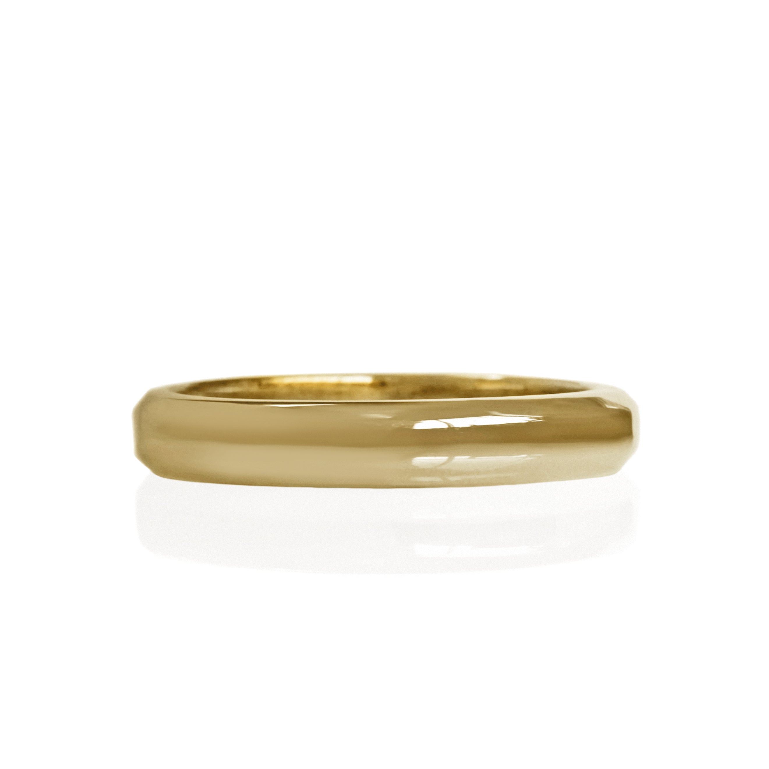 A product photo of a mens' ring made of 9k yellow gold. The band is softly rounded in a D shape.