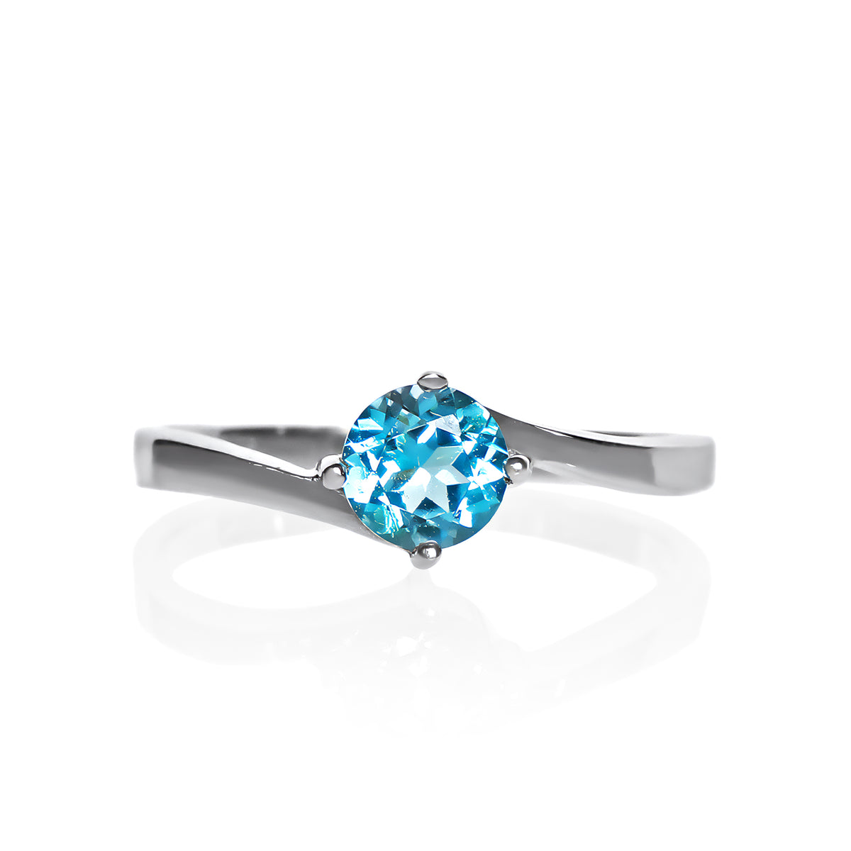 A product photo of a curved-band silver solitaire ring with a bright blue Blue Topaz centre stone sitting on a white background.