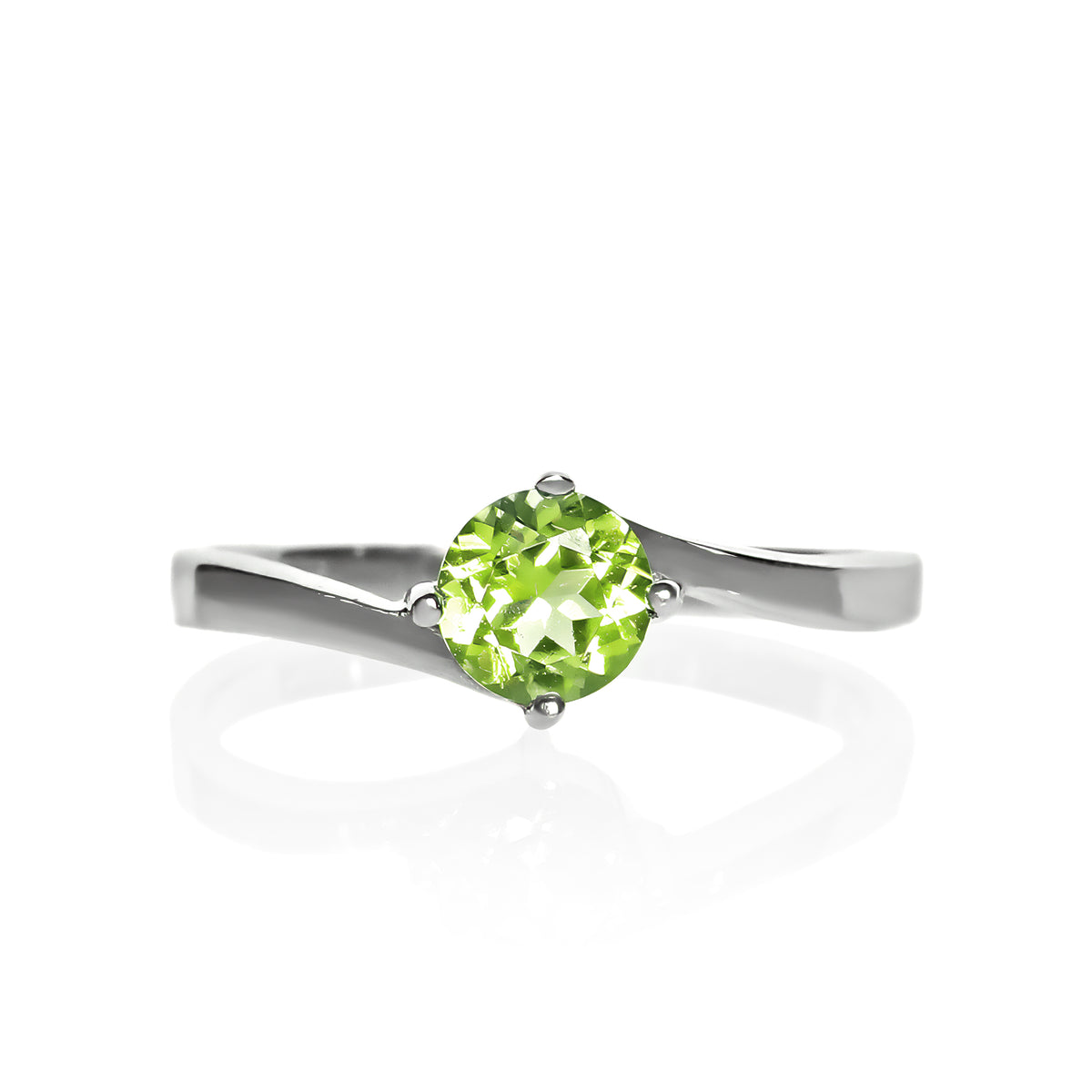 A product photo of a curved-band silver solitaire ring with a grass green peridot centre stone sitting on a white background.