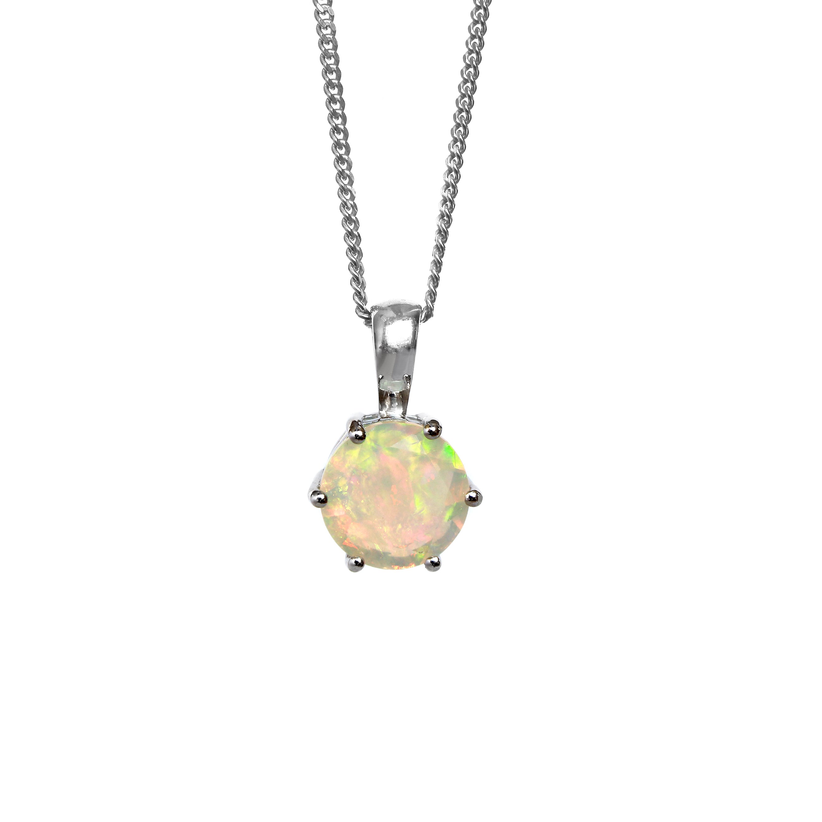 A product photo of a silver Ethiopian Rainbow Opal pendant suspended by a silver chain over a white background. The semi-opaque, light-toned opal reflects rainbow-coloured fire from its faceted edges.