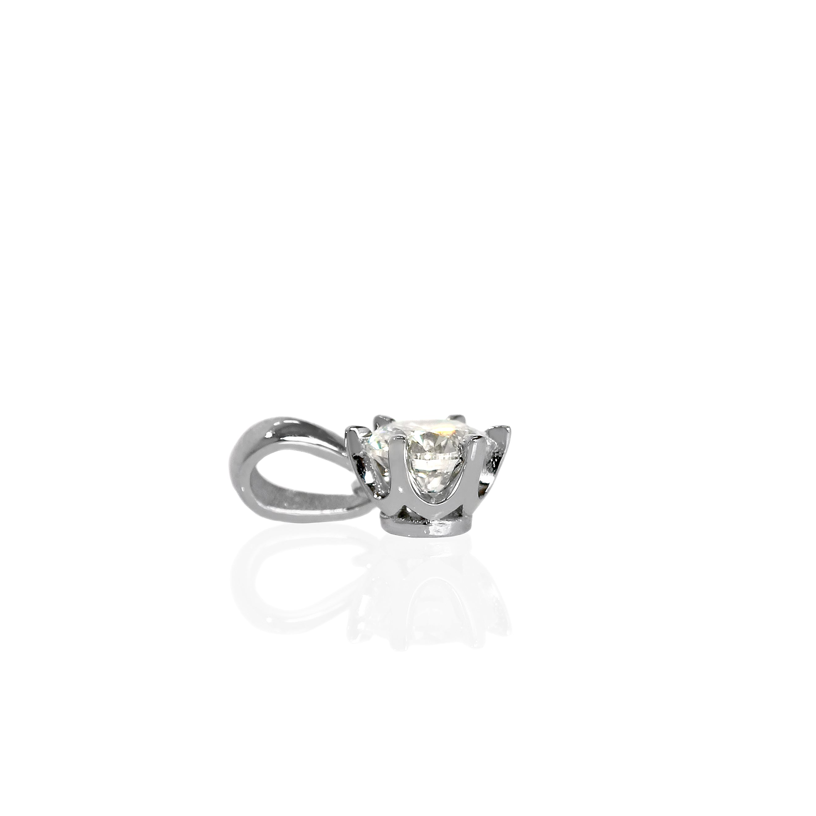 A product photo of dazzling lab diamond pendant suspended by a white gold chain over a white background. The stone is a stunningly-bright 0.502ct round brilliant-cut jewel, and is perfectly secured in place by 6 delicate 14 karat white gold claws. The pendant would make an excellent birthday gift for a wearer born in April, given the diamond birthstone in its centre.