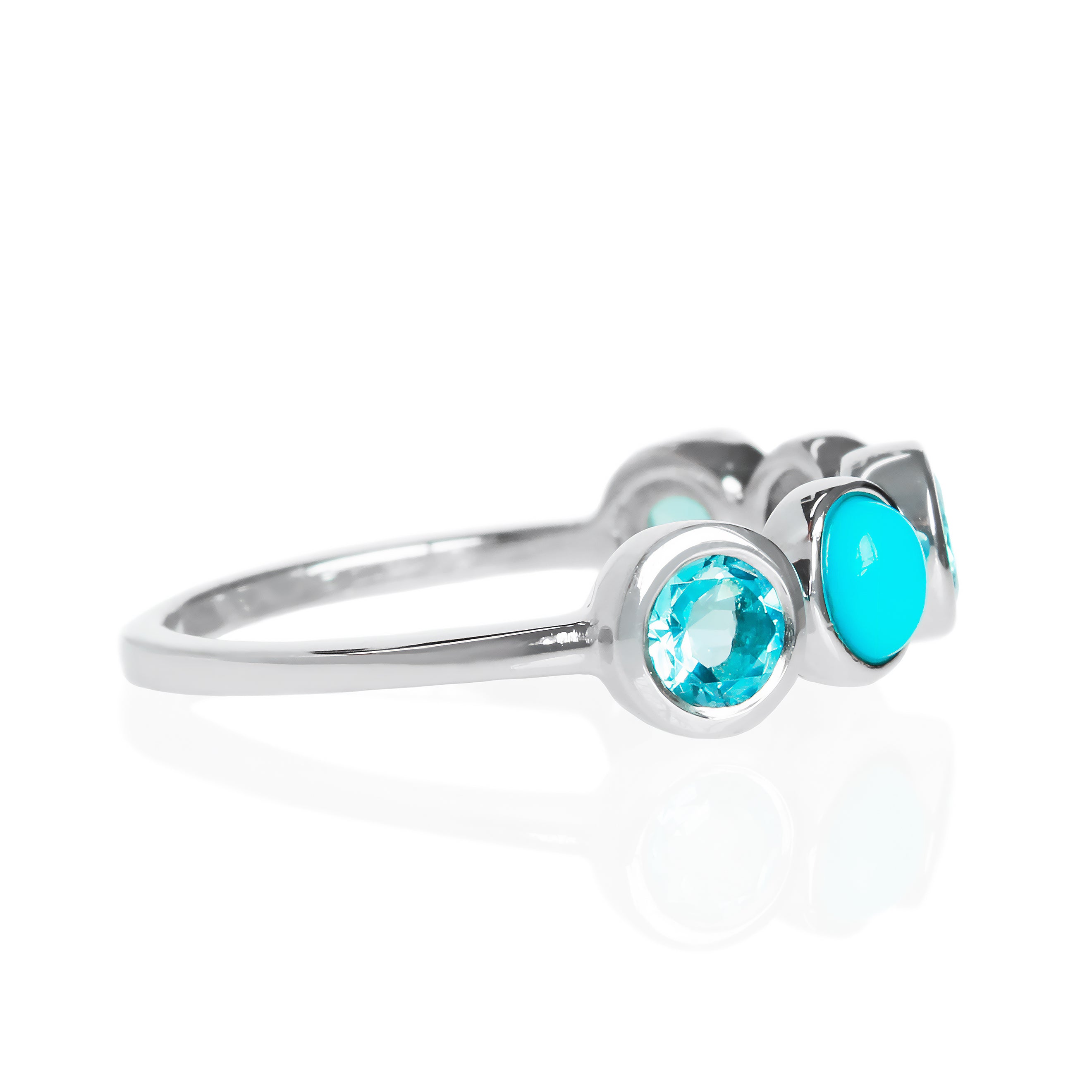 A product photo of a turquoise and blue topaz silver ring on a white background. The ring consists of 5 stones total, all 4mm in width, each encased in a layer of silver bezel setting. The 5-stone arrangement includes 3 dazzling blue topaz stones in a faceted cut, interspersed with 2 cabochon-cut blue turquoise stones - straight from the Sleeping Beauty mountains of Arizona.