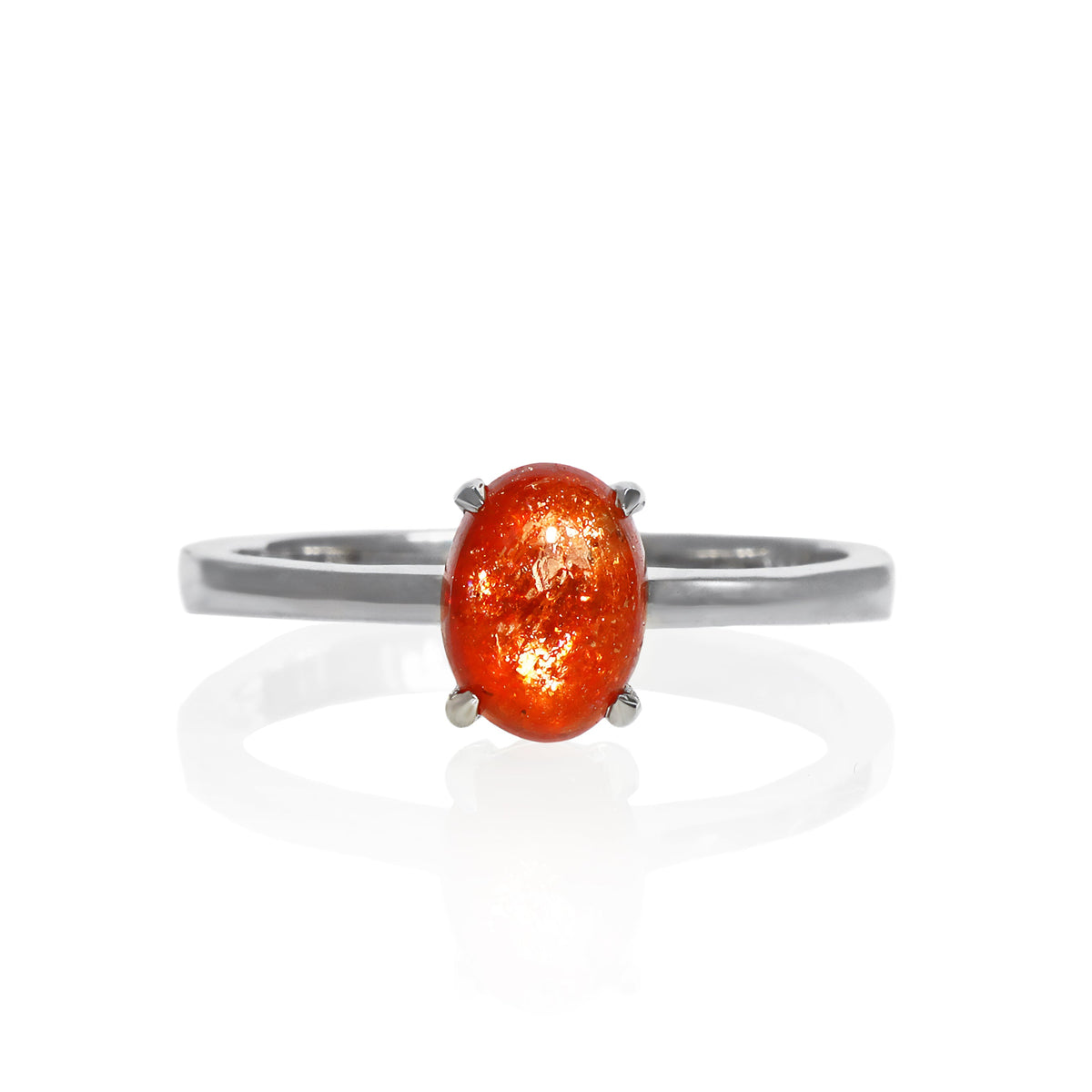 A product photo of an oval 925 sterling silver solitaire ring on a white background. The band is rounded and smooth, and the 7x5mm sunstone jewel is held in place by 4 delicate silver claws.