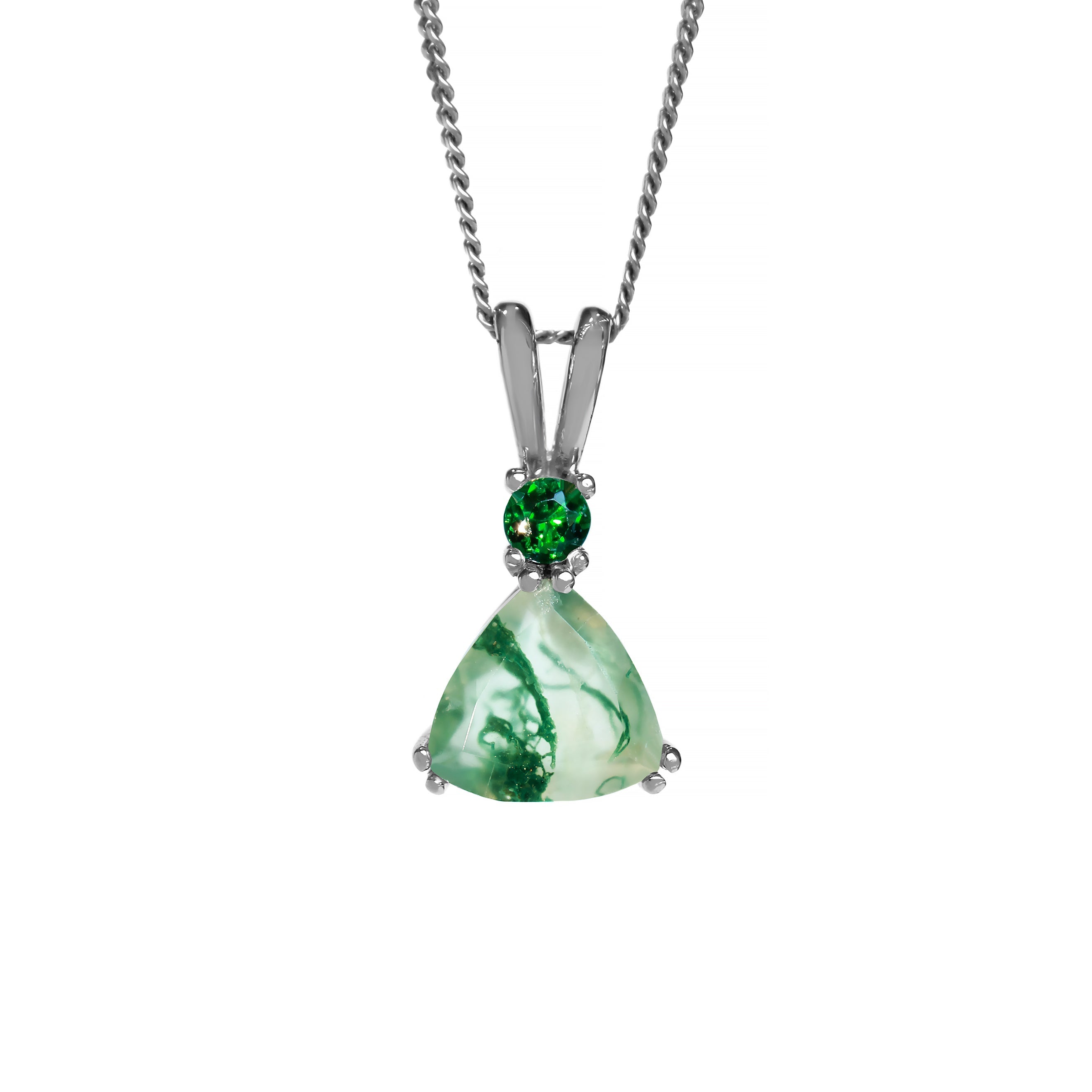 A product photo of a white gold moss agate and green gemstone necklace suspended against a white background. The beautifully unique trilliant moss agate stone is held in place by 2 claws on each corner, with a singular vibrant green gemstone connecting the stone to pendant's split bail.