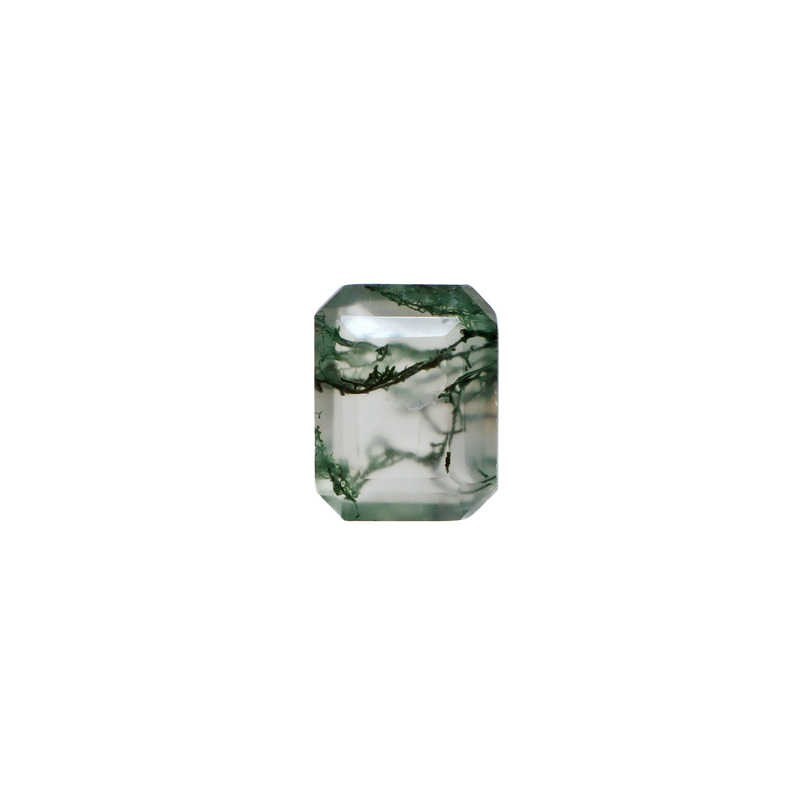An exquisite 9x7mm Faceted Emerald-cut Moss Agate loose gemstone on a plain white background, showcasing intricate deep forest green "moss-like" dendritic inclusions, beautifully suspended within a clear, faceted crystal base. As a highly popular shape, this product is strongly preferred by bespoke engagement clients.