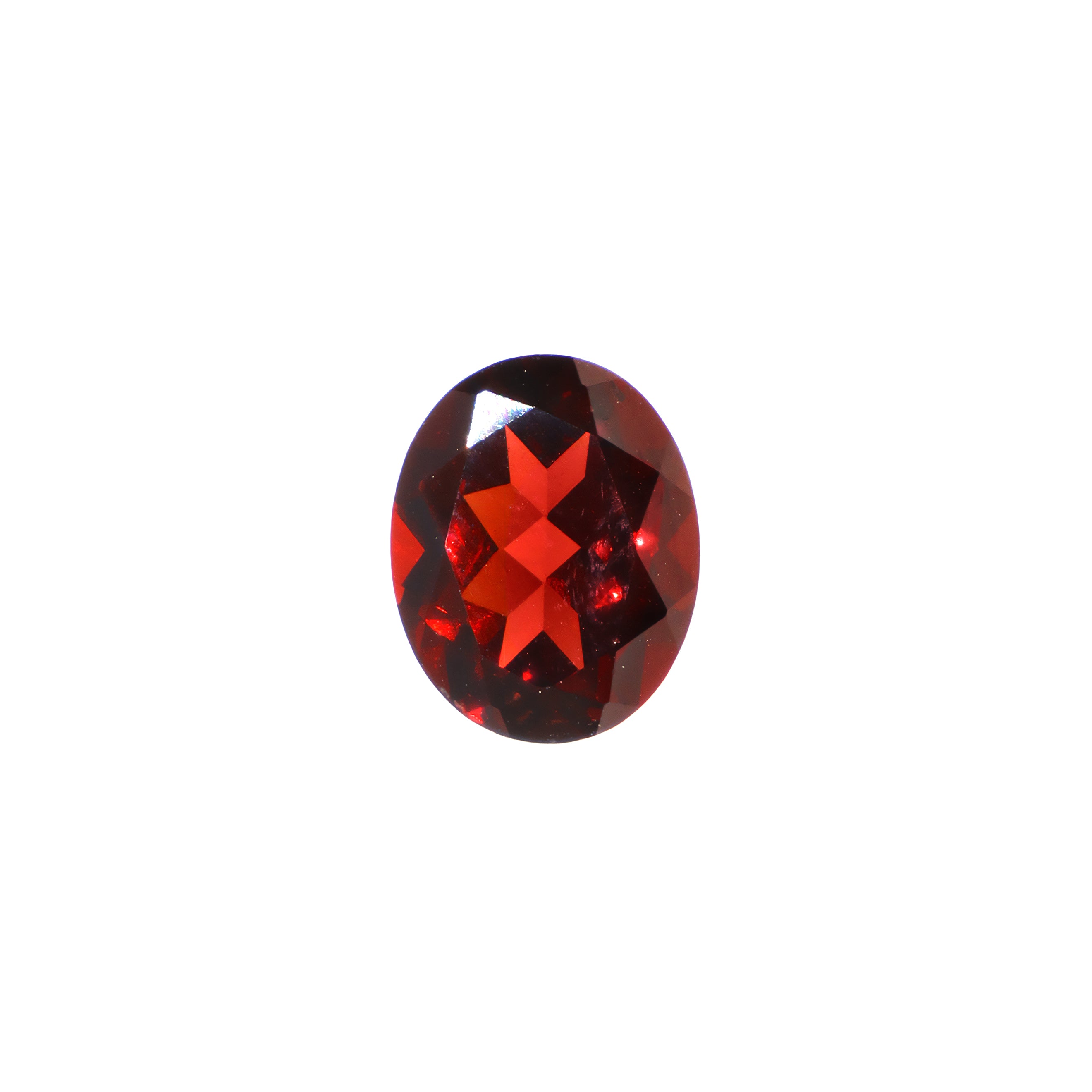 A loose 10x8mm oval cut red Mozambican garnet gemstone on a white background. This brilliant, richly coloured garnet, January's birthstone, is perfect for creating custom fine jewellery: including engagement rings, cocktail rings, or a striking birthstone pendant for a loved one born in January. The colouring is a deep, rich scarlet red. The size is large, but small enough for use in everyday wearable jewellery - and is not limited to statement designs.