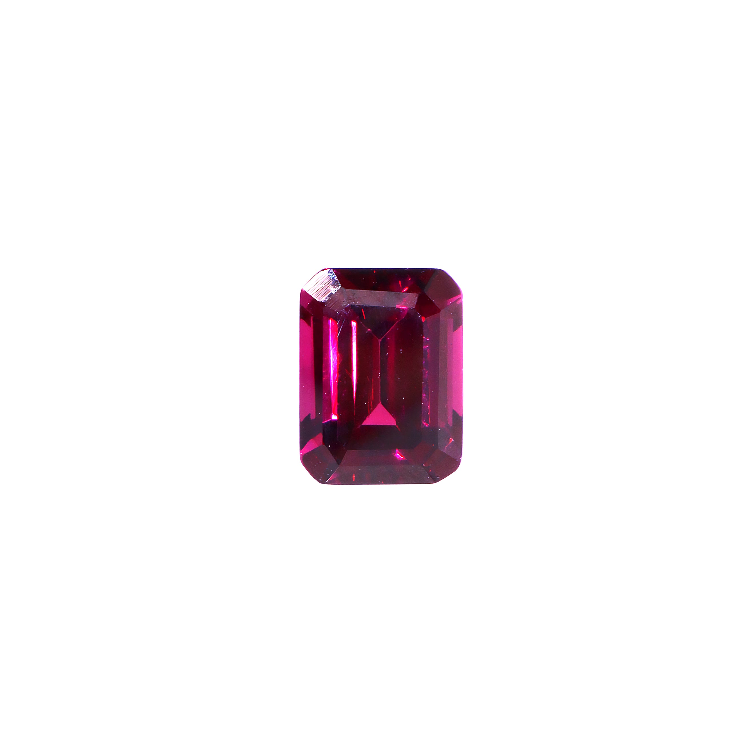 A loose 8x6mm octagonal cut grape garnet gemstone on a white background. This brilliant, richly coloured grape garnet, a variant of January's birthstone, is perfect for creating custom fine jewellery: including engagement rings, cocktail rings, or a striking birthstone pendant for a loved one born in January. The size is large, but small enough for use in everyday wearable jewellery - and is not limited to statement designs.