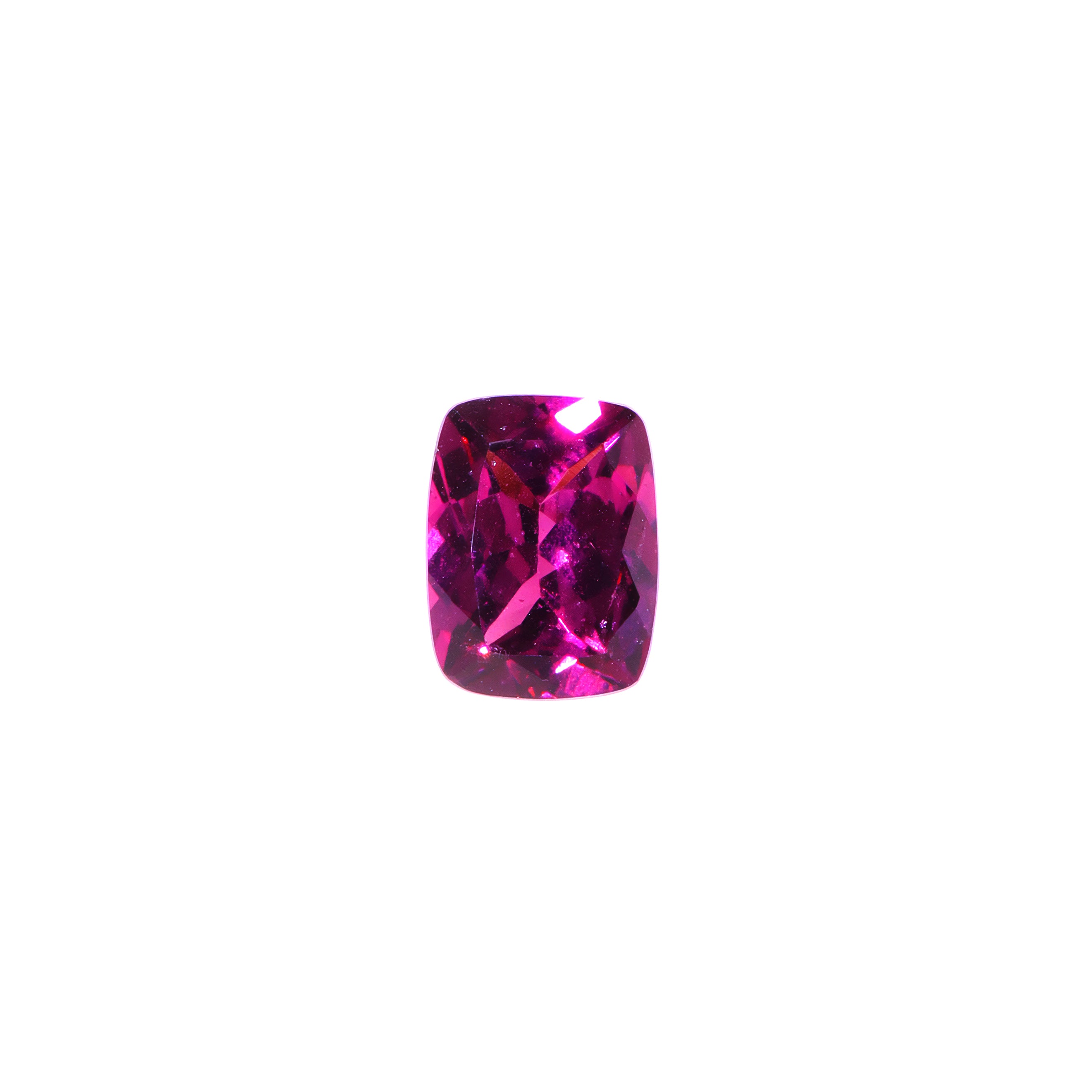 A loose 8x6mm rectangular / elongated cushion-cut grape garnet gemstone on a white background. This brilliant, richly coloured grape garnet, a variant of January's birthstone, is perfect for creating custom fine jewellery: including engagement rings, cocktail rings, or a striking birthstone pendant for a loved one born in January. The size is large, but small enough for use in everyday wearable jewellery - and is not limited to statement designs.