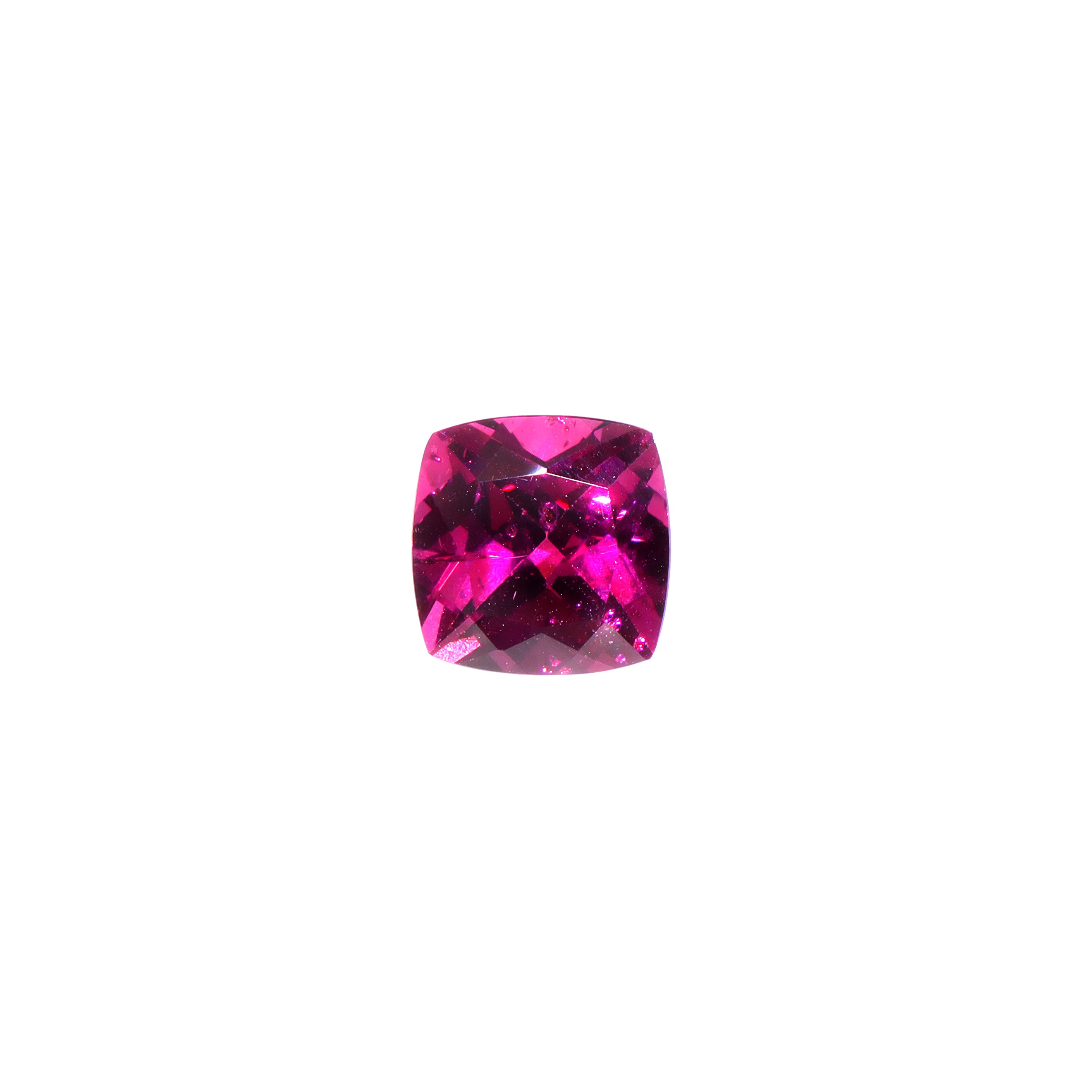 A loose 7mm cushion cut deeply-coloured grape garnet gemstone on a white background. This large, brilliantly cut natural grape garnet displays a vibrant warm purple, winelike hue, perfect for use in bespoke luxury jewellery designs. An excellent choice for a January birthstone pendant, or as an addition to one's personal gemstone collection.