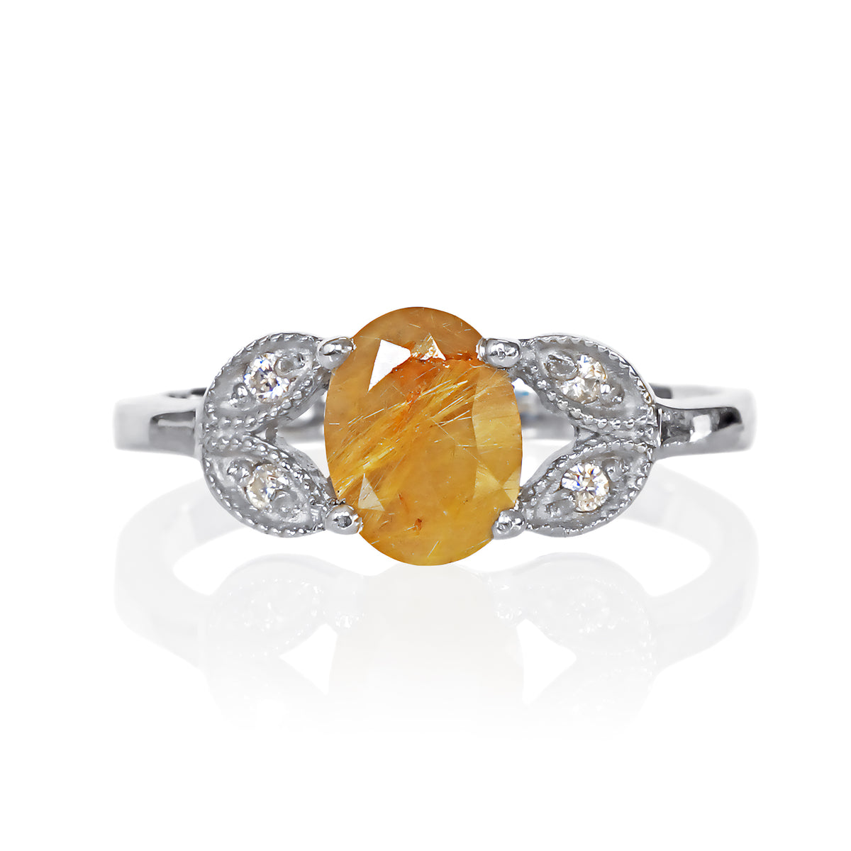A product photo of an oval golden rutilated quartz and moissanite ring with floral silver detailing set in solid 925 sterling silver metal. The bold 8x6mm golden rutilated quartz gemstone is held in place by two petal shapes in filigree silver detailing on either side, each "petal" adorned with a single moissanite in the centre, to a total of 4.