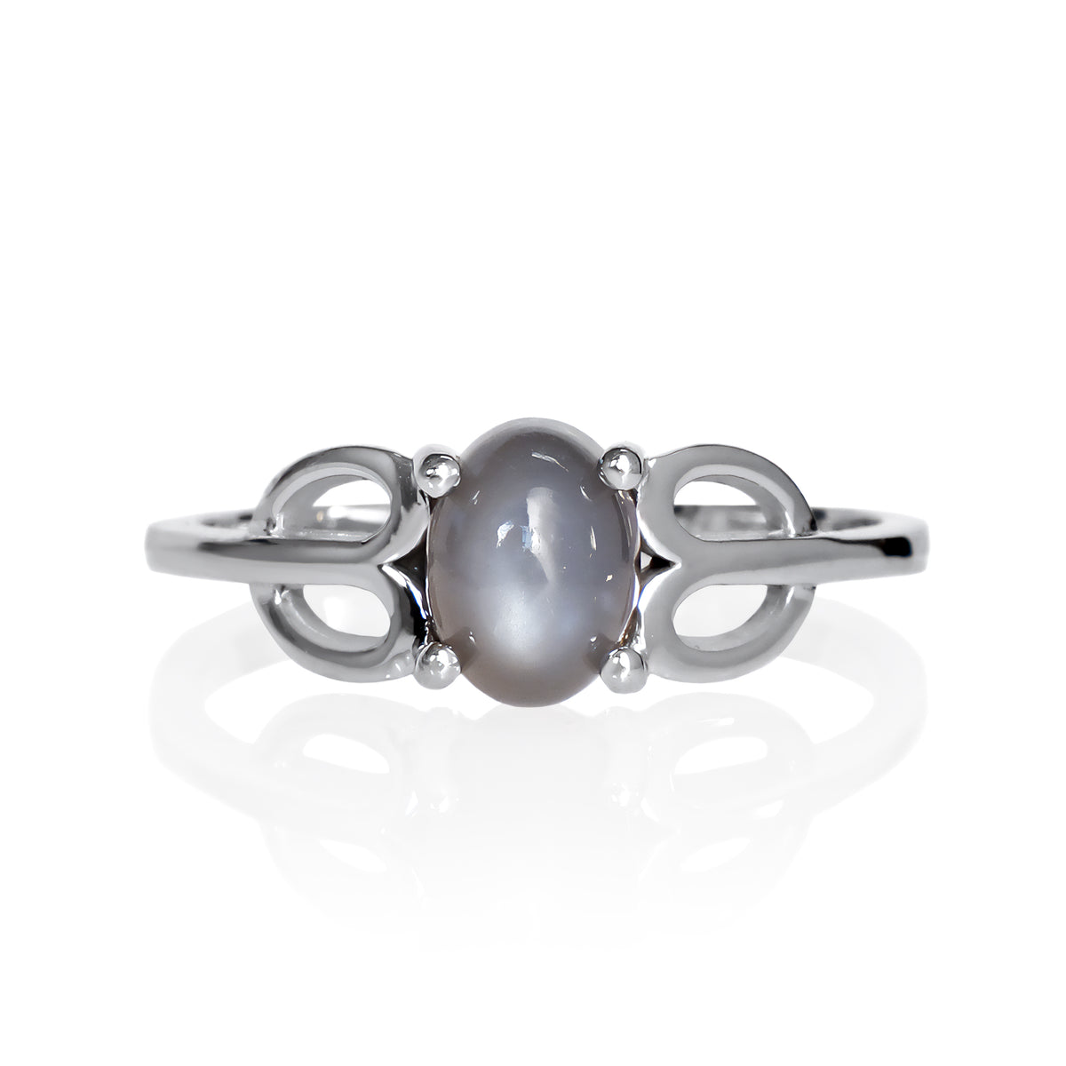 A product photo of a silver grey moonstone ring on a white background. The ring consists of a single 7x5mm cabochon-cut moonstone stone hugged between two looping silver "petals" on either side, which transition into a smooth flat band in the middle.