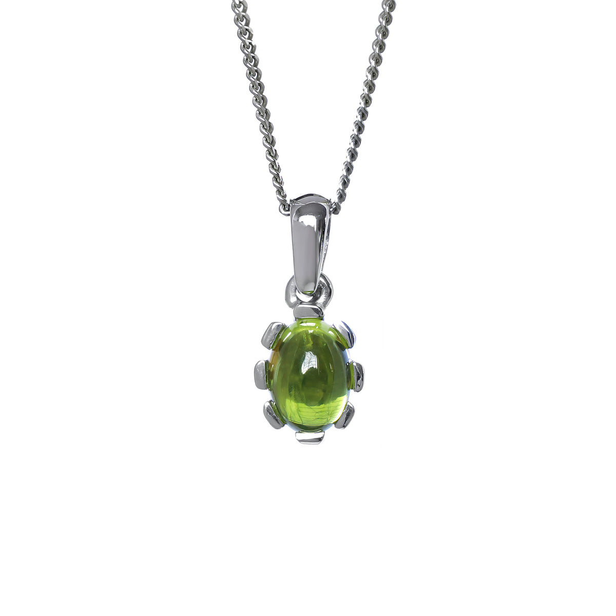 A product photo of a cabochon purple peridot set in solid sterling silver suspended by a silver chain over a white background. The smooth cabochon peridot is framed by flowery sterling silver detailing.