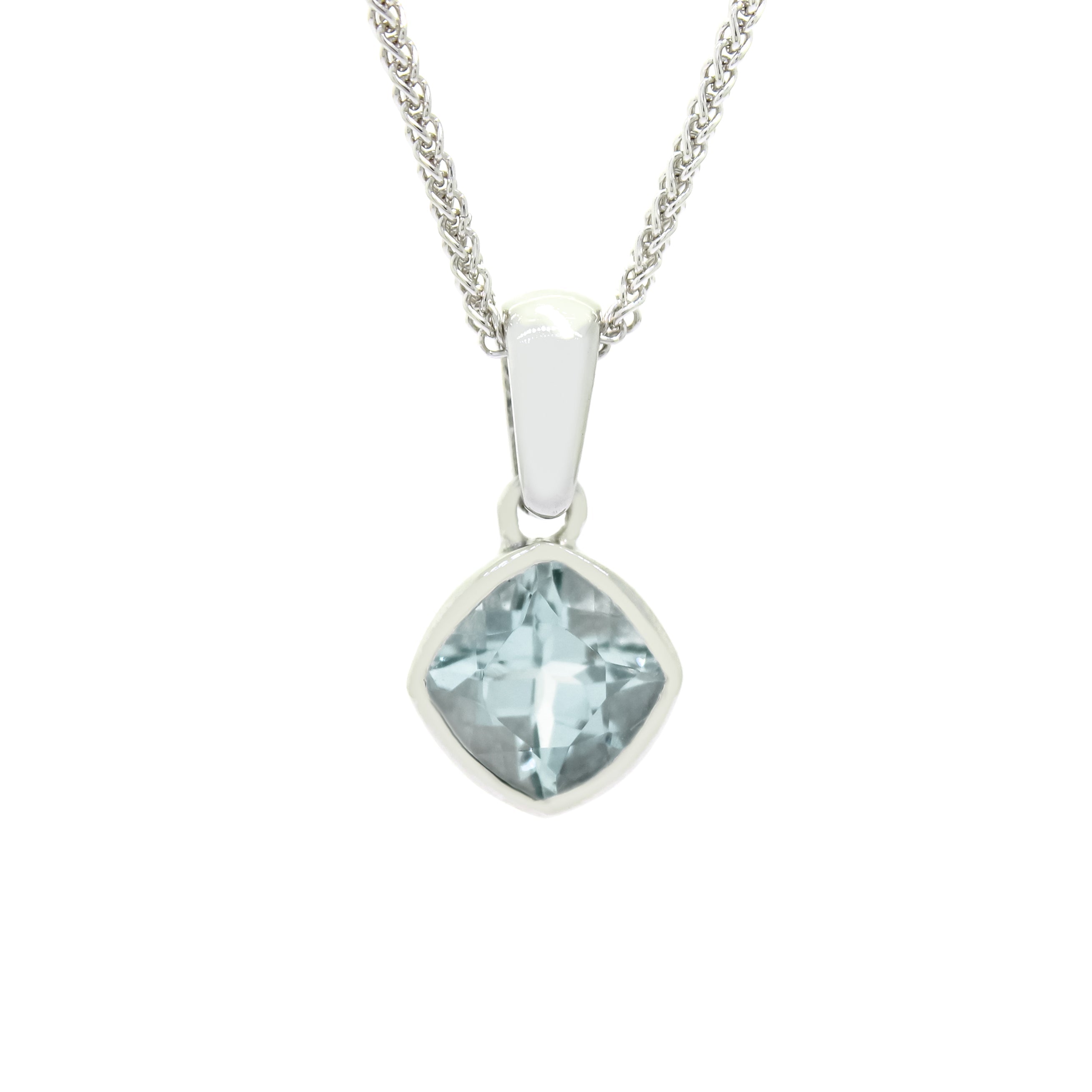 A product photo of a white gold aquamarine pendant suspended by a chain against a white background. The squared cushion-cut stone is oriented diagonally and is encased in a thick layer of white gold bezel setting. It reflects pale baby blue colours from its many edges.