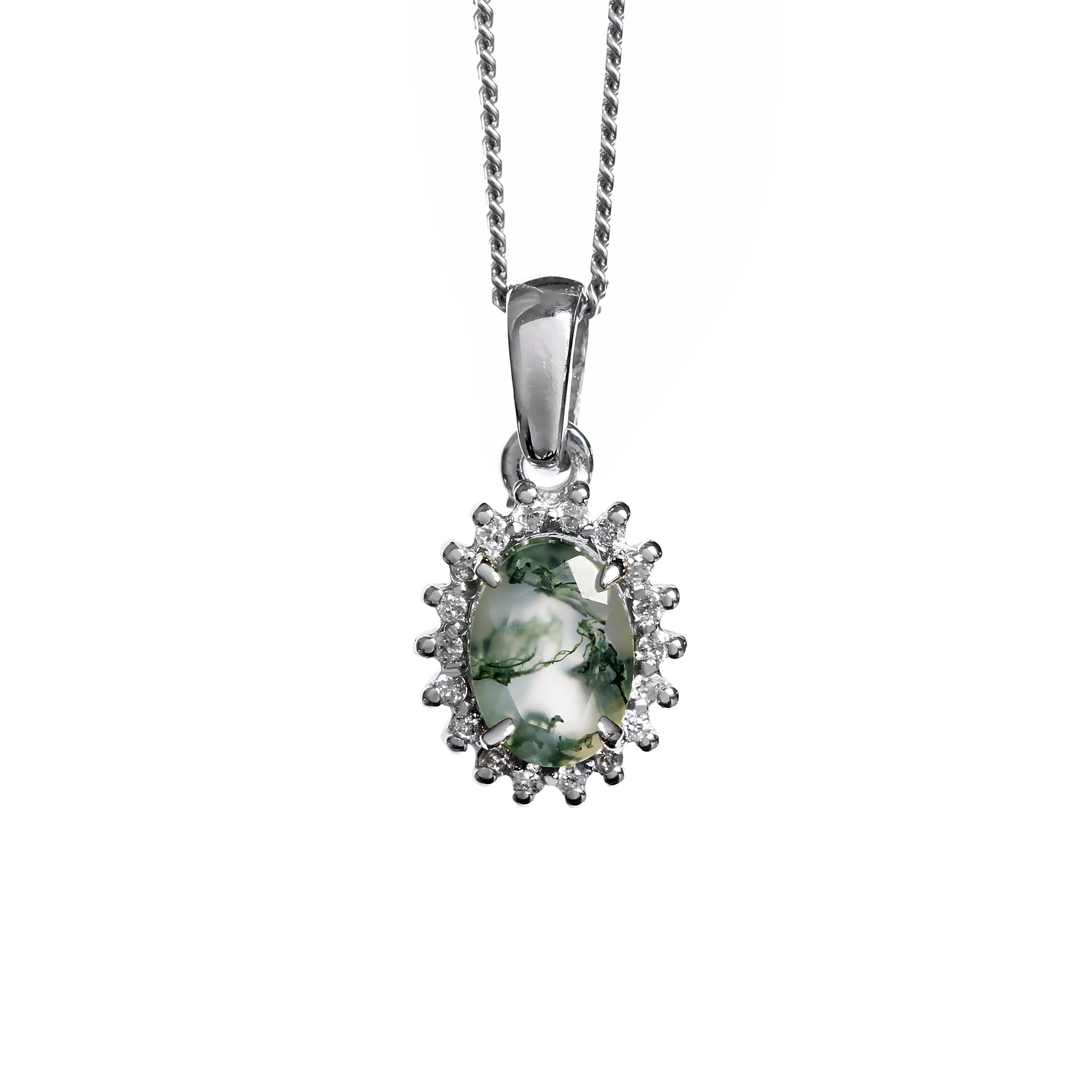 A product photo of an ornate moss agate pendant bejewelled with a diamond halo suspended by a golden chain against a white background. The moss agate gemstone is oval-shaped, with light semi-opaque base colouring and swirling, dendritic tendrils of deep green inclusions. and is surrounded by a star-like halo of white gold and diamond details.