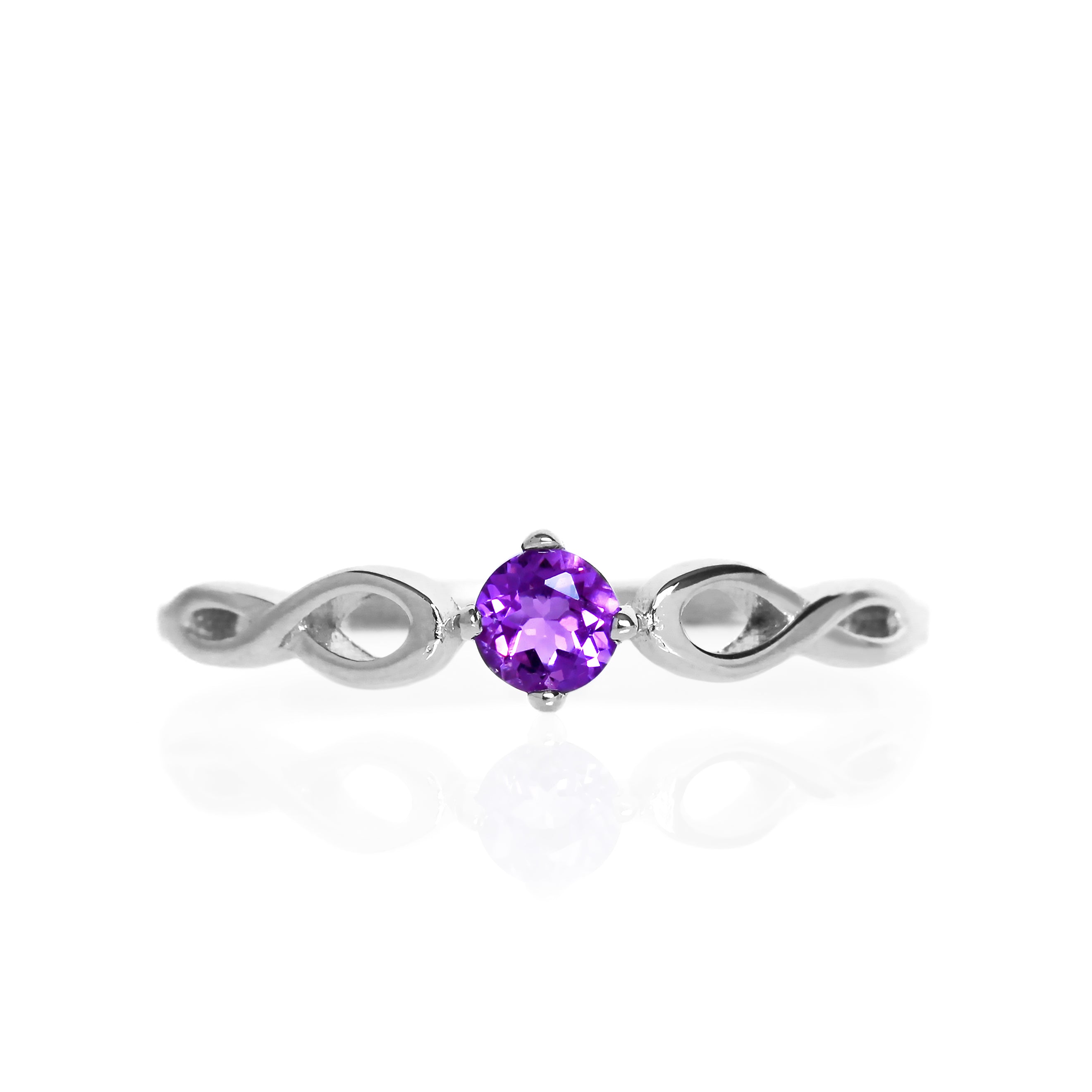 A product photo of an ornate silver ring with an amethyst centre stone sitting on a white background. The silver band splits halfway along its length, becoming twisting and serpentine in appearance before meeting on either side of the dazzling purple 3.5mm stone, which is held in place by 4 silver claws.