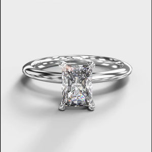 
            
                Load and play video in Gallery viewer, A product photo of a 14 karat white gold lab diamond engagement ring sitting in the sun on a white textured background. The brilliant, colourless 1ct emerald-cut diamond measures about 6.7mm lengthwise, and is held in place by 4 delicate golden claws in a prong setting.
            
        