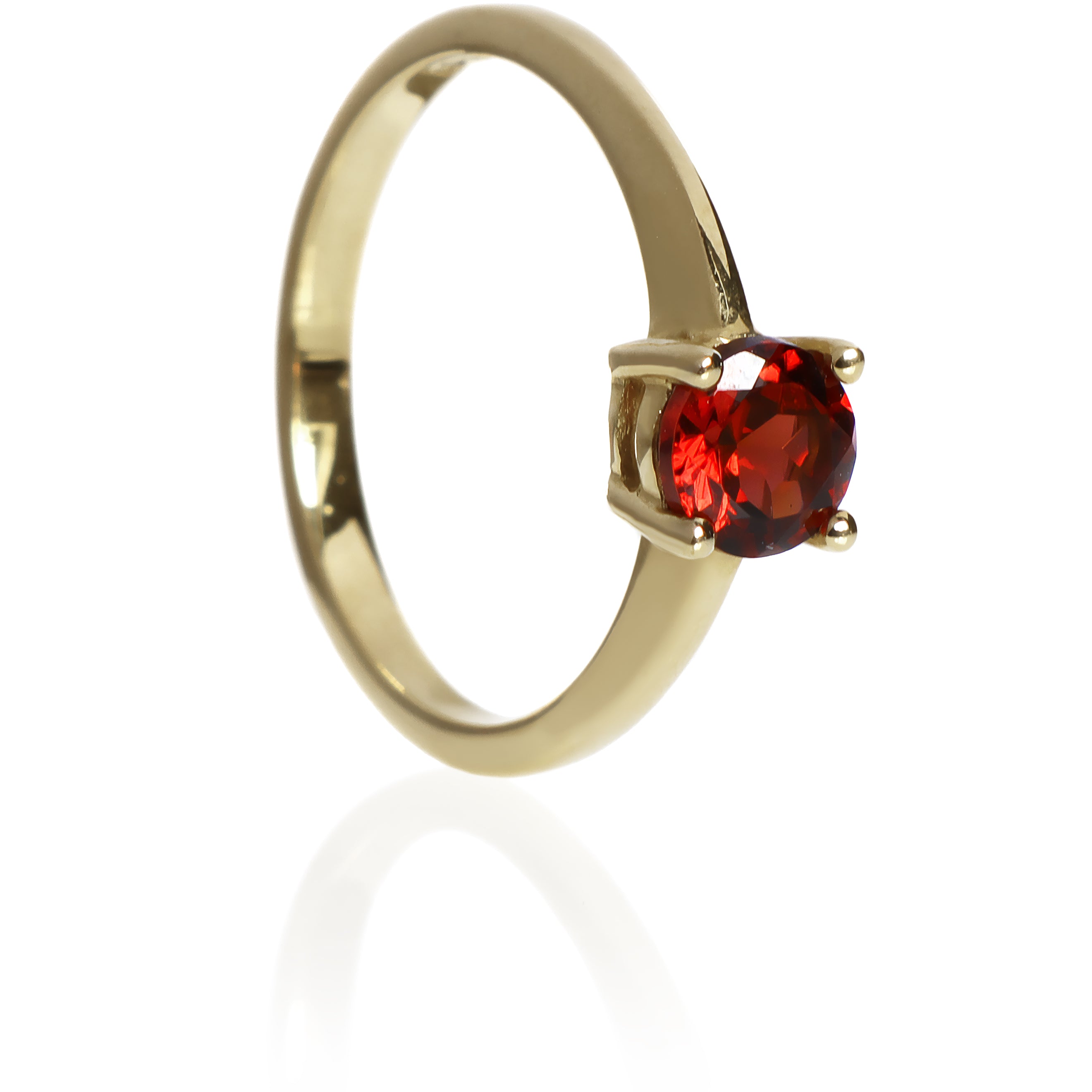 A product photo of a Round Garnet Solitaire Ring in 9k Yellow Gold sitting on a plain white background. The garnet centre stone measures 5.5mm. The stones are a deep red, reflecting sanguine hues across their multi-faceted edges.