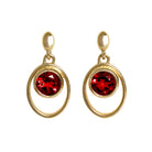 A product photo of 5.5mm Round Bezel-set Garnet Earring Studs in 9k Yellow Gold sitting on a plain white background. The bezel-set stones are nestled at the top of golden oval loops of similar thickness to the bezel frames. The garnets reflect sanguine hues across their multi-faceted edges.