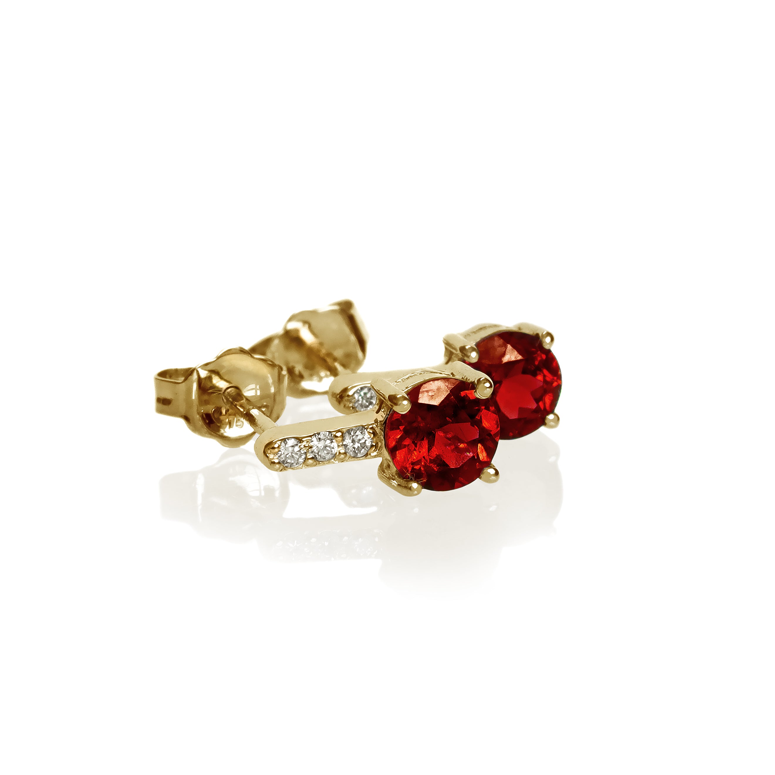A product photo of 5mm Round Garnet & Diamond Earrings in 9k Yellow Gold sitting on a plain white background. A golden strip connects the garnets to the studs, each strip adorned with 3 diamonds each. The garnets reflect sanguine hues across their multi-faceted edges.