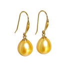 A product photo of a simple pair of yellow gold shepherd's hook earrings suspending two golden pearls over a white background.