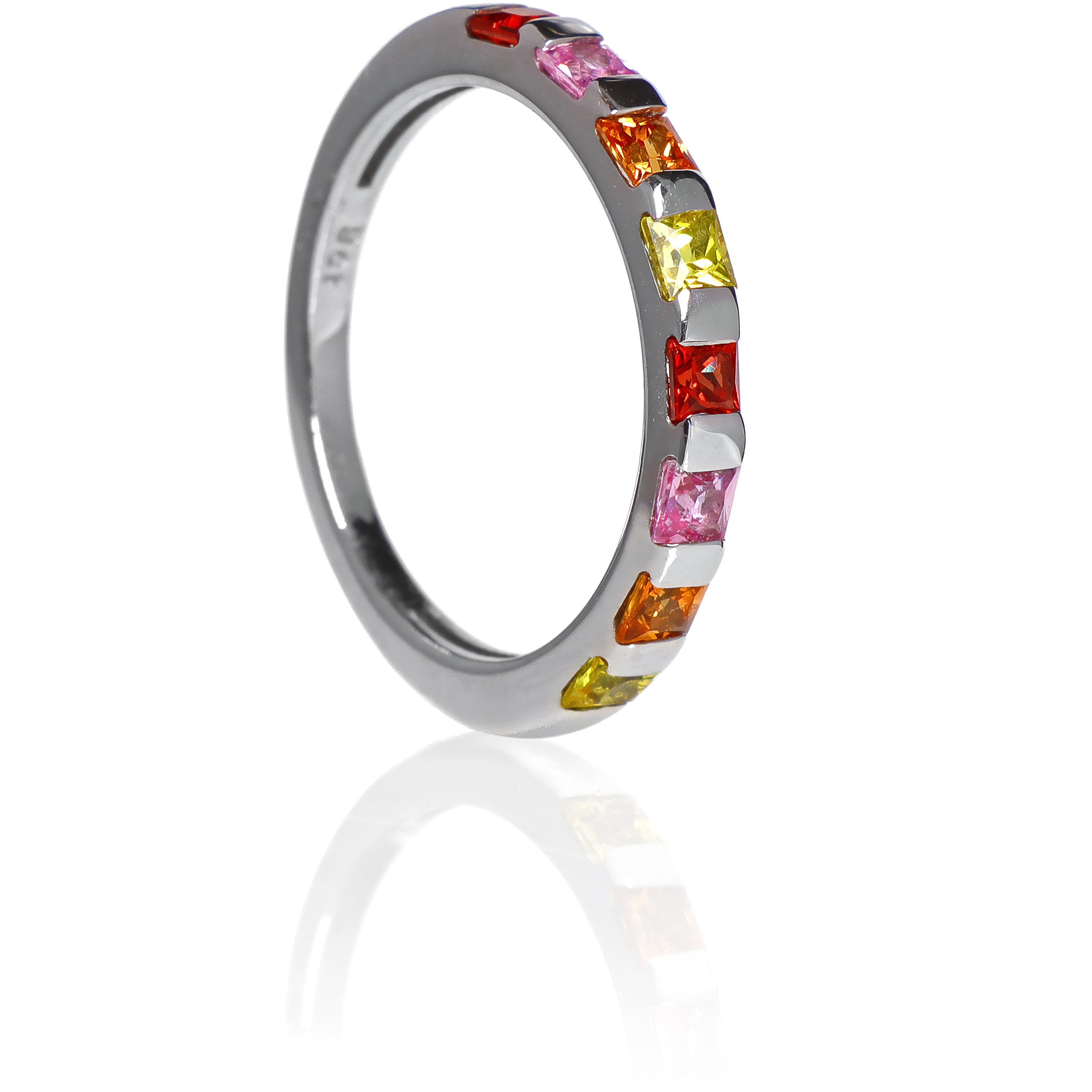 A product photo of a bold, multi-gemstone stacking ring in 9k white gold – made up of multi-coloured sapphire jewels – sitting on a white background.