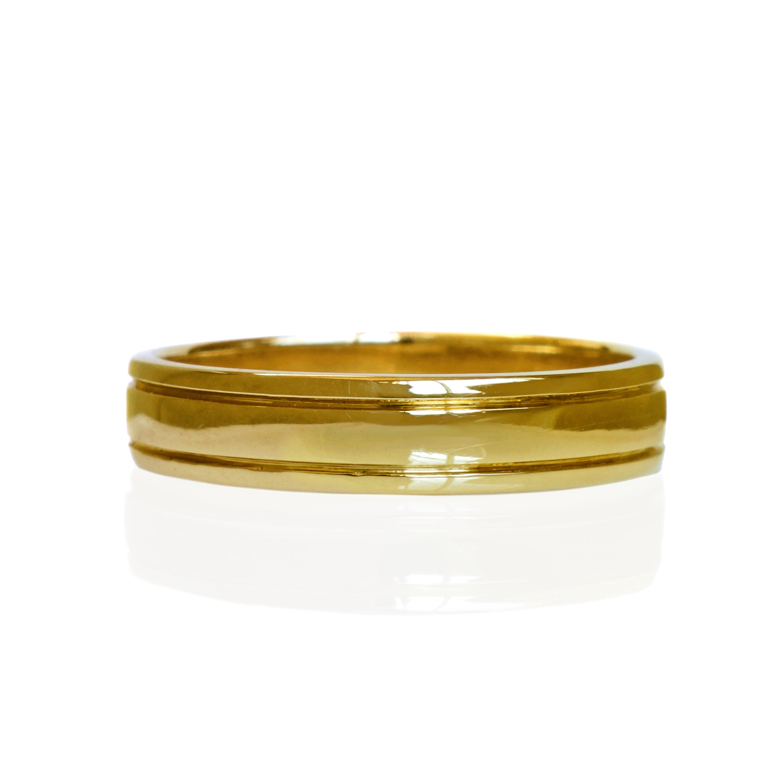 A product photo of a mens' ring made of 9k yellow gold. The band is 5mm tall and detailed with two polished grooves running along its length.
