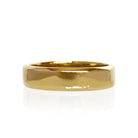 A product photo of a mens' ring made of 9k yellow gold. The band is 5mm tall and flat, and has bold squared edges.