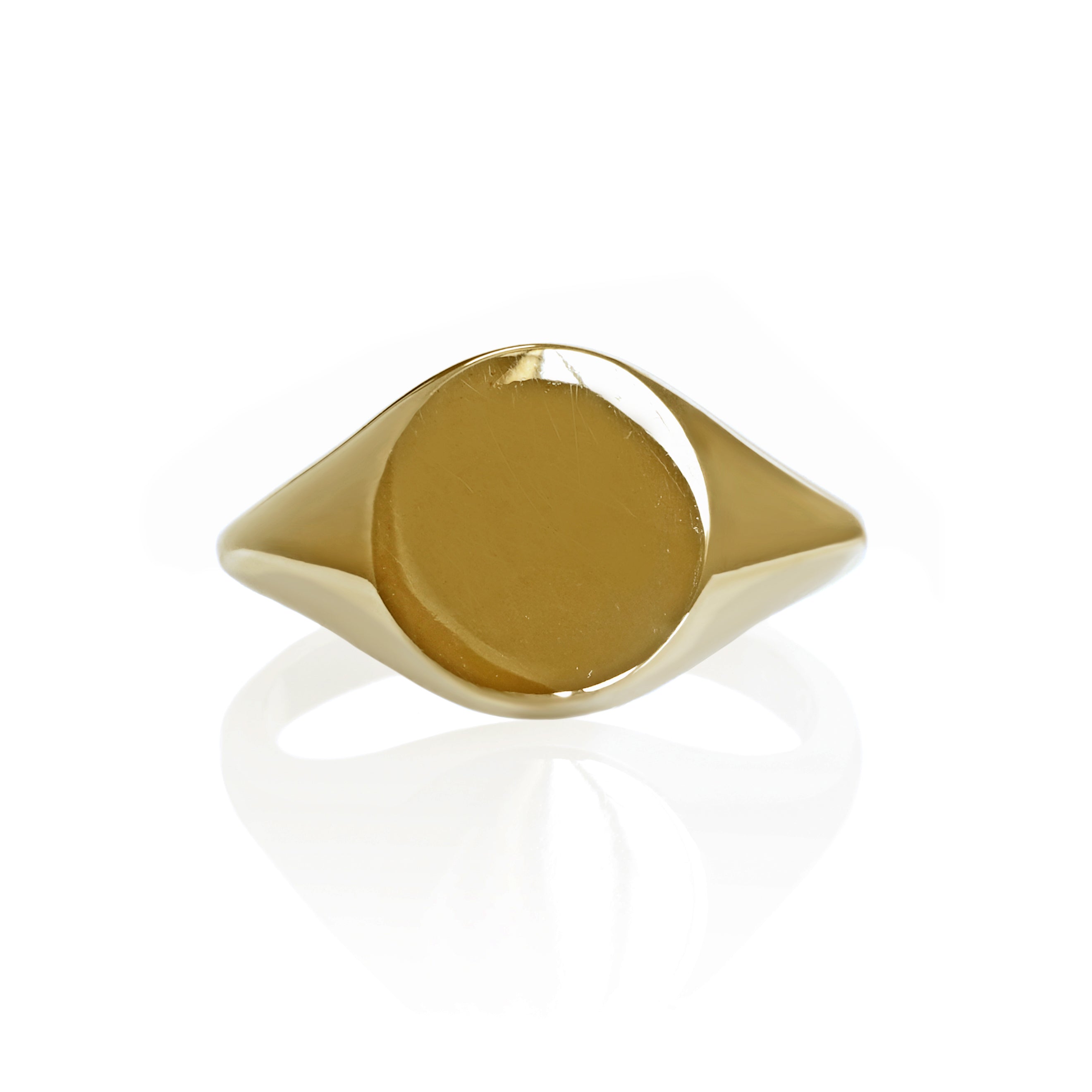 A product photo of a mens' signet ring made of 9k yellow gold. The face of the ring is a 10mm round flat circle that transitions to a thick rounded band.