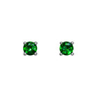 A product photo of two white gold stud earrings sitting on a white background. Held in place by 4 silver claws each are two dazzling round-cut green tsavorite gemstones, reflecting shades of forest-green light from their many edges. The green gemstone colours make these earrings a good alternative or substitute for emerald.