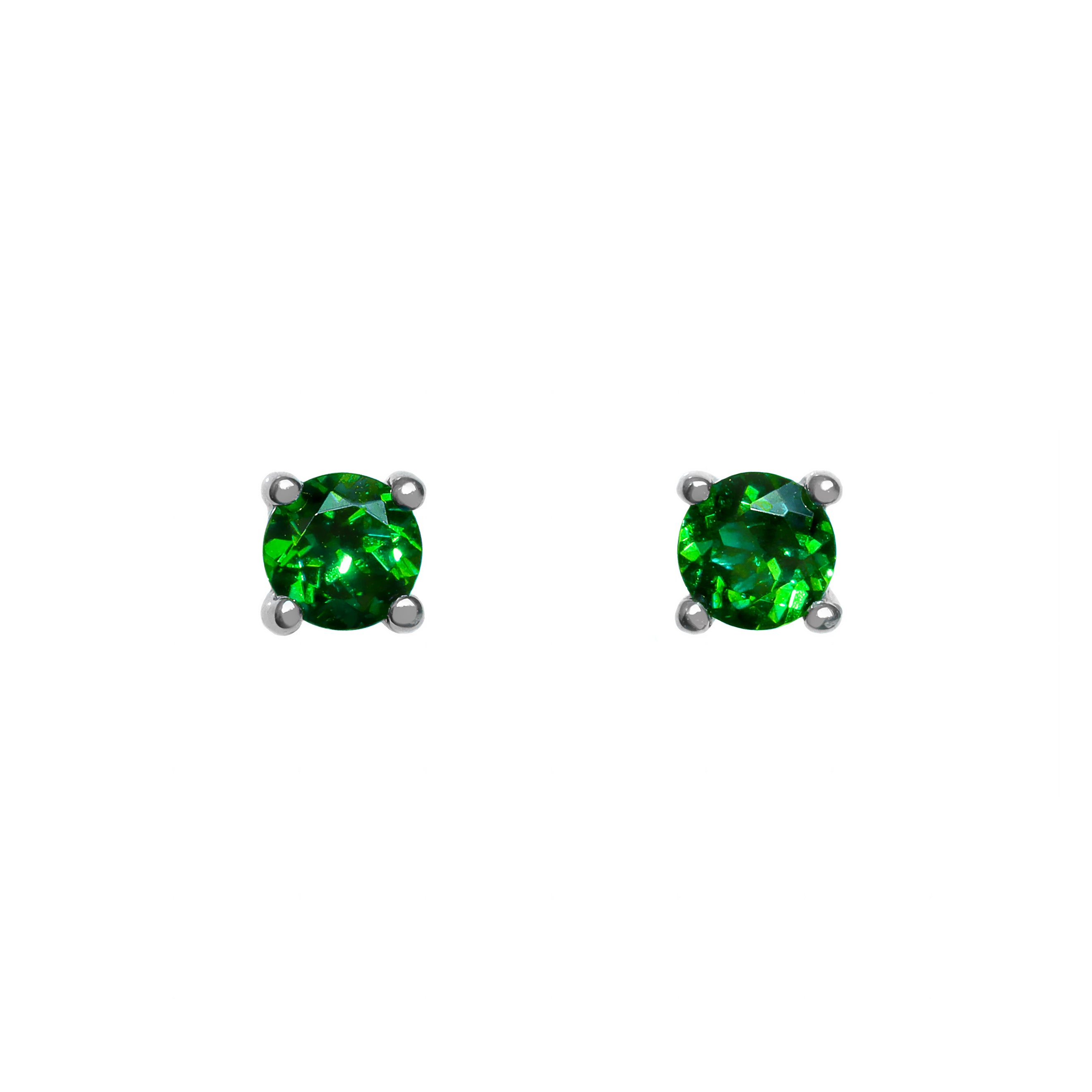 A product photo of two white gold stud earrings sitting on a white background. Held in place by 4 silver claws each are two dazzling round-cut green tsavorite gemstones, reflecting shades of forest-green light from their many edges. The green gemstone colours make these earrings a good alternative or substitute for emerald.