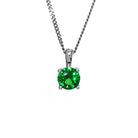 A product photo of a white gold tsavorite pendant suspended by a chain against a white background. The round stone is held in place by 4 small claws, and reflects electric green and verdant colours from its many edges.