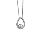 A product photo of a moissanite pendant in solid 925 sterling silver suspended by a silver chain on a clear white background. The pendant is in the shape of a small teardrop, with a petite silver-encased circle-cut moissanite gem nestled at its base. The silver teardrop shape is smooth and unblemished.