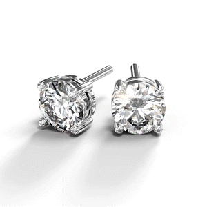 A turntable video of a pair of 9 karat white gold lab diamond stud earrings sitting in the sun on a white textured background. The brilliant, colourless half pointer round diamonds measure 5mm across, and are held in place by a simple 4-claw setting.