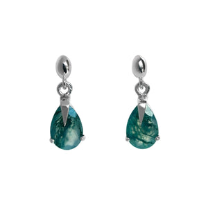 A product photo of a pair of 9x7mm pear-shaped moss agate drop earrings in 925 sterling silver on a white background. The gemstones have a cool white milky colour, with deep, swirling green natural inclusions, and are each held in place with a singular sharp prong, giving them a severe yet elegant appearance.