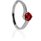 A product photo of a curved-band silver solitaire ring with a crimson red garnet centre stone sitting on a white background. The deep red gemstone colour would be a good ruby alternative.