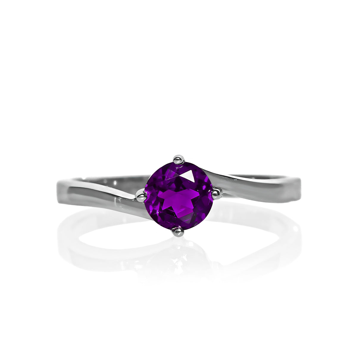 A product photo of a curved-band silver solitaire ring with a deep purple amethyst centre stone sitting on a white background.