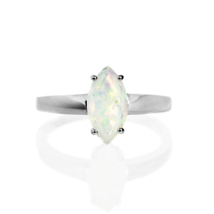 A product photo of a silver rainbow opal solitaire ring on a white background. The 12x6mm marquise-shaped faceted opal stone is uniquely translucent, with a light base tone and rainbow-coloured fire. The stone is held in place with 4 silver claws.