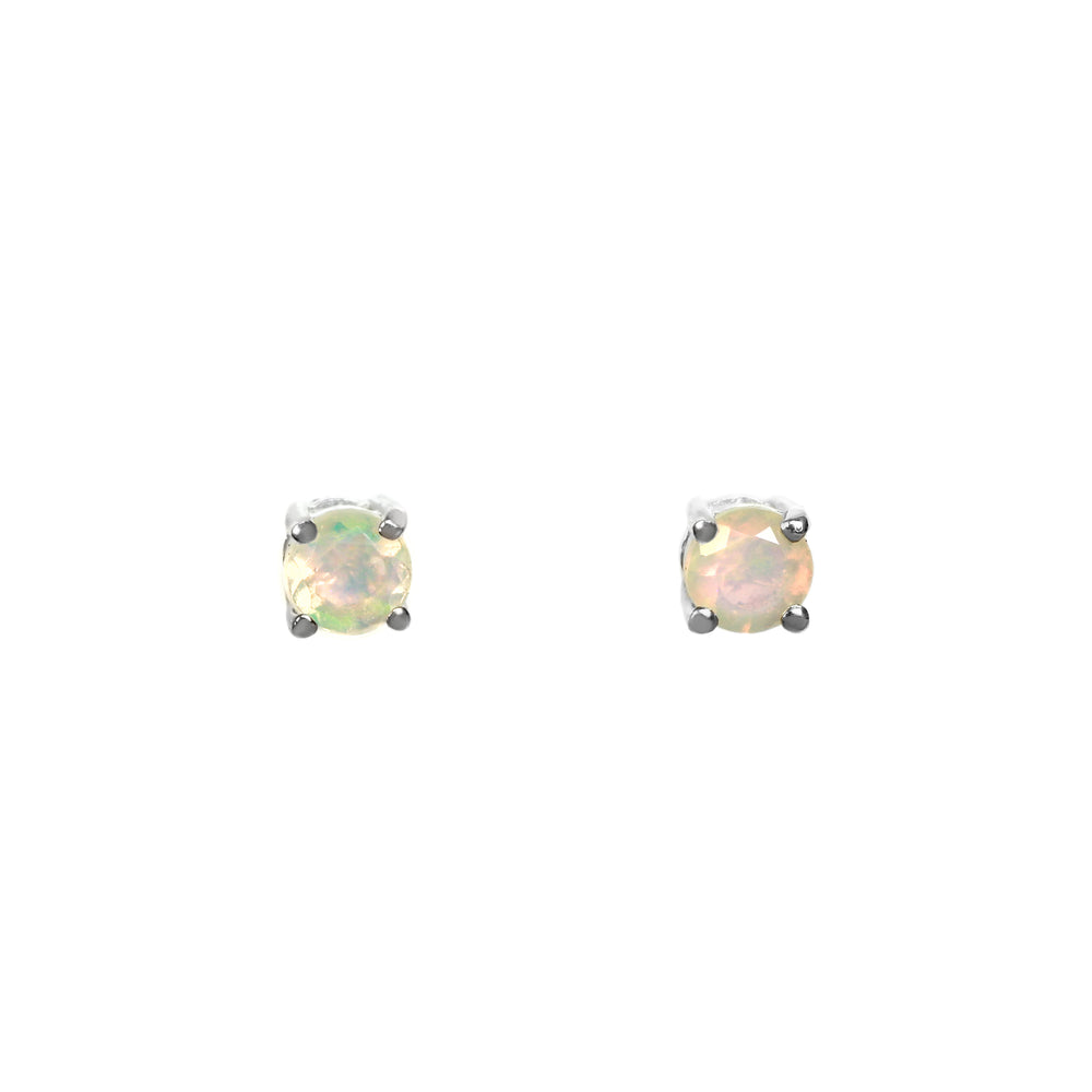 
            
                Load image into Gallery viewer, A product photo of two silver stud earrings sitting on a white background. Held in place by 4 silver claws each are two dazzling round-cut rainbow opal gemstones, reflecting multi-coloured fire from their many faceted edges.
            
        