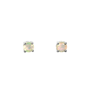 A product photo of two silver stud earrings sitting on a white background. Held in place by 4 silver claws each are two dazzling round-cut rainbow opal gemstones, reflecting multi-coloured fire from their many faceted edges.
