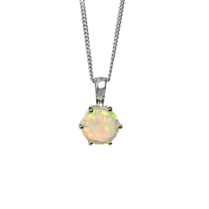 A product photo of a silver Ethiopian Rainbow Opal pendant suspended by a silver chain over a white background. The semi-opaque, light-toned opal reflects rainbow-coloured fire from its faceted edges.