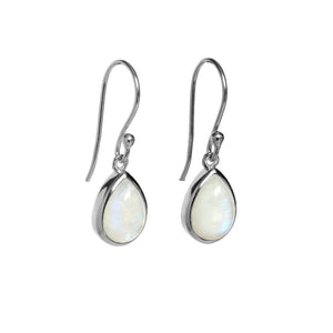 A product photo of a pair of sterling silver moonstone drop earrings suspended against a white background. The drop earrings feature shepherd hooks, and the 9x6mm pear-shaped cabochon grey moonstones are held in place by silver bezel settings. 