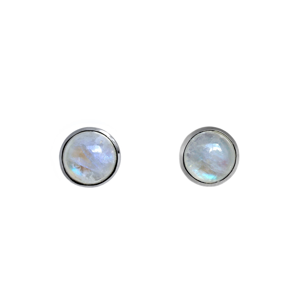 A product photo of a pair of silver moonstone stud earrings sitting against a white background. The 8mm round gemstones have a grey and blue sheen and unique milky inclusions, and are secured in place in bezel settings.