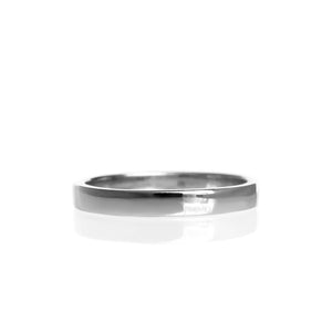 A product photo of a mens wedding band made of 9k white gold on a white background. The band has flat edges.