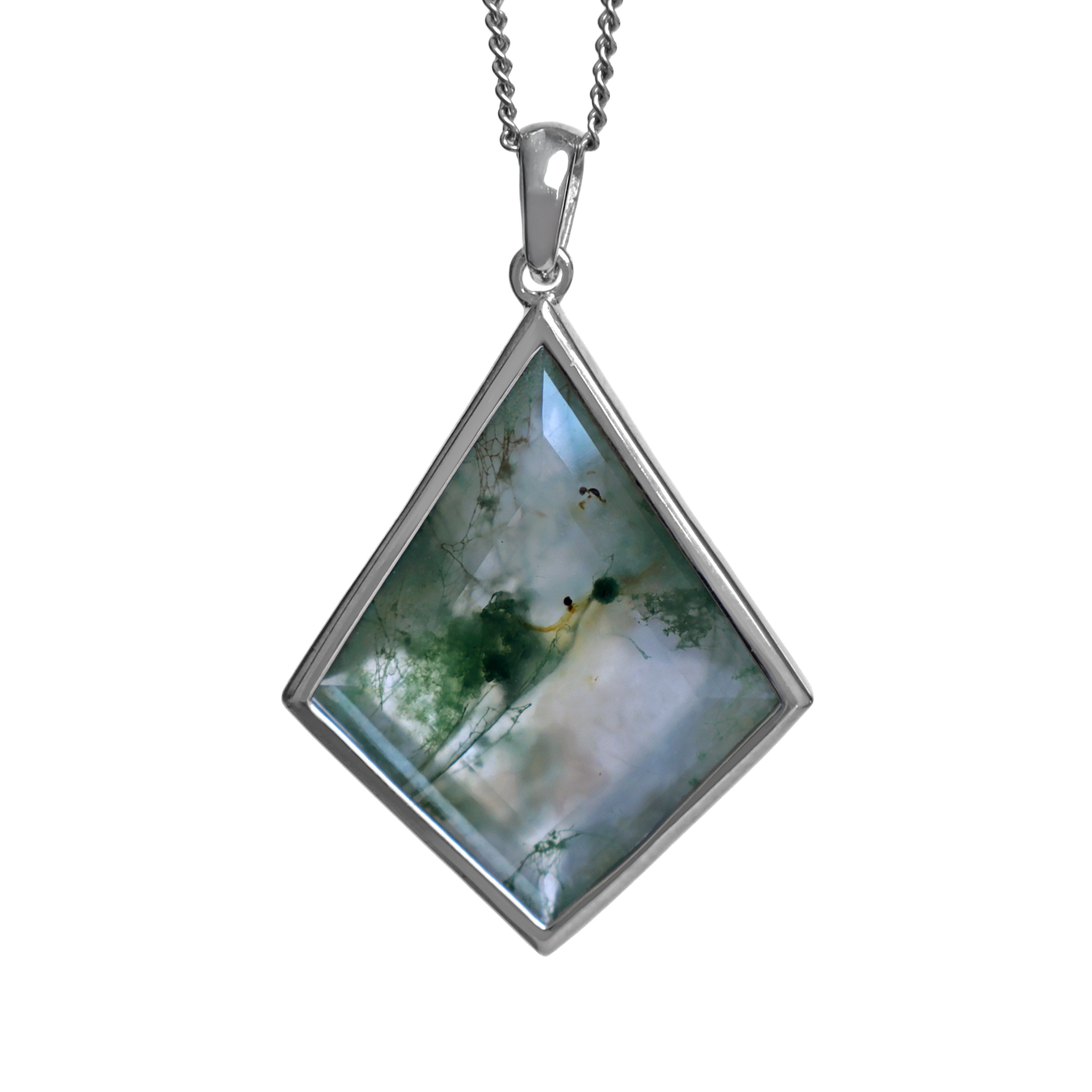 A product photo of a silver moss agate pendant on a silver chain, against a white background. The kite-shaped stone, set in a polished silver bezel, is translucent with milky white and pale grey areas. Striking dark green inclusions resemble moss or plant fronds, creating a natural pattern.