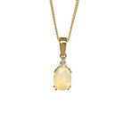 A product photo of a yellow gold hydrophane Ethiopian rainbow opal and diamond necklace sitting against a white background. The beautifully unique rainbow opal stone is held in place by 4 pairs of claws at its top and bottom, with a trio of delicate white diamonds connecting the stone to the rest of the pendant. It is suspended by a simple yellow gold chain.