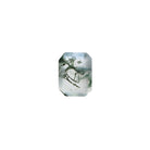 An exquisite 9x7mm Faceted Emerald-cut Moss Agate loose gemstone on a plain white background, showcasing intricate deep forest green "moss-like" dendritic inclusions, beautifully suspended within a clear, faceted crystal base. As a highly popular shape, this product is strongly preferred by bespoke engagement clients.