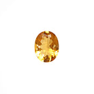 A loose 13x10mm oval citrine gemstone on a white background. This brilliant, golden-yellow citrine, November's birthstone, is perfect for creating custom fine jewellery: including engagement rings, cocktail rings, or a striking birthstone pendant for a loved one born in November. The size is large, but small enough for use in everyday wearable jewellery - and is not limited to statement designs.