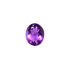 A loose 12x9mm oval amethyst gemstone on a white background. This brilliant, royal purple amethyst, is perfect for creating custom fine jewellery: including engagement rings, cocktail rings, or a striking birthstone pendant for a loved one born in February. The size is large, but small enough for use in everyday wearable jewellery - and is not limited to statement designs.