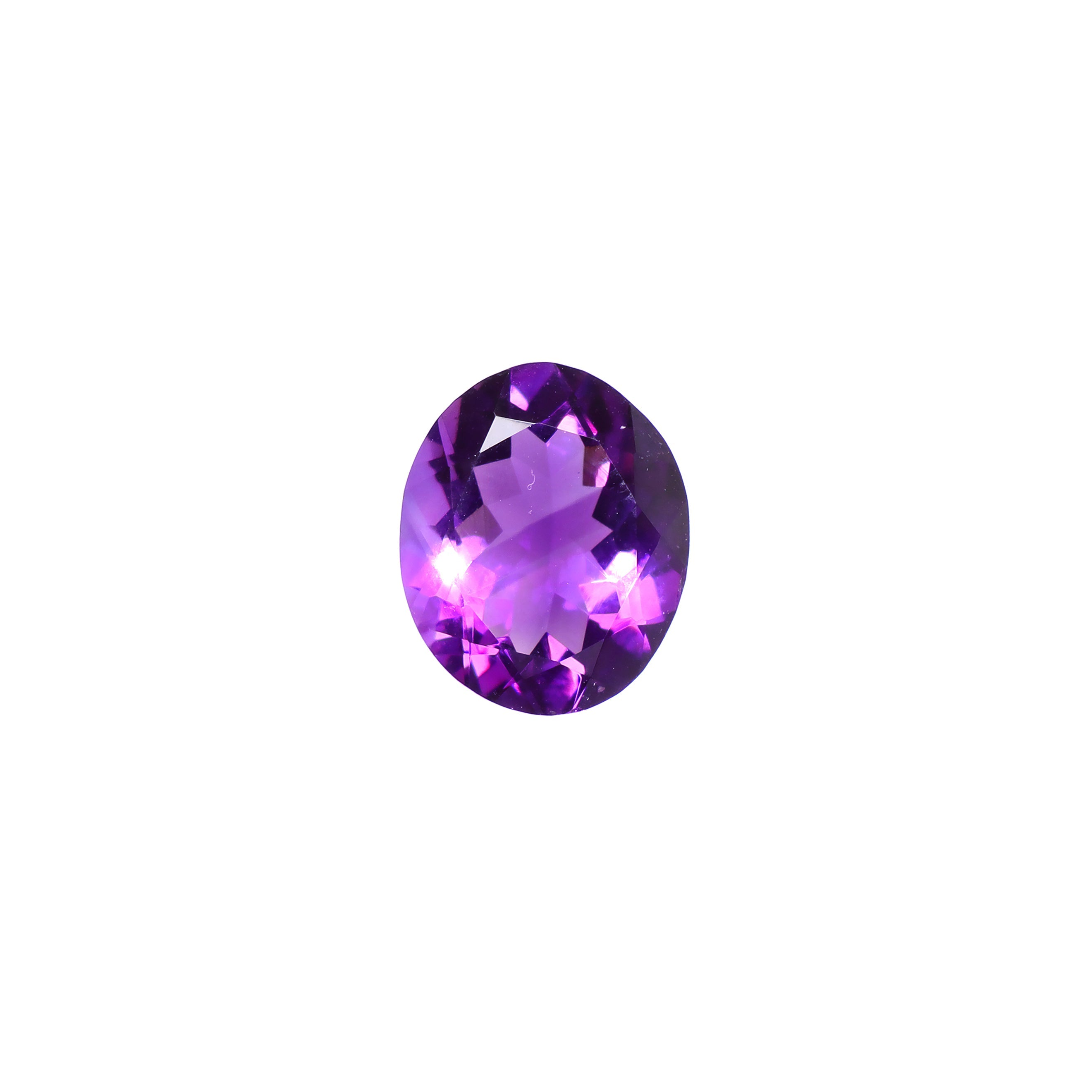 A loose 12x9mm oval amethyst gemstone on a white background. This brilliant, royal purple amethyst, is perfect for creating custom fine jewellery: including engagement rings, cocktail rings, or a striking birthstone pendant for a loved one born in February. The size is large, but small enough for use in everyday wearable jewellery - and is not limited to statement designs.